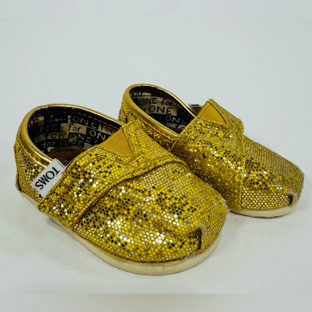 TOMS 2T Yellow Gold Sparkly Toddler Shoes with Velcro Strap.